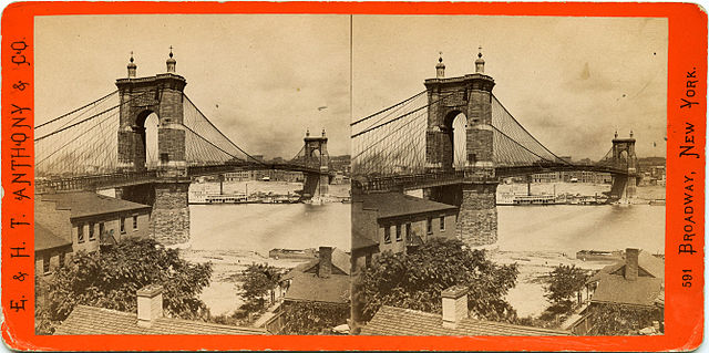 side-by-side picture of a suspension bridge with high stone towers at either side spanning a river